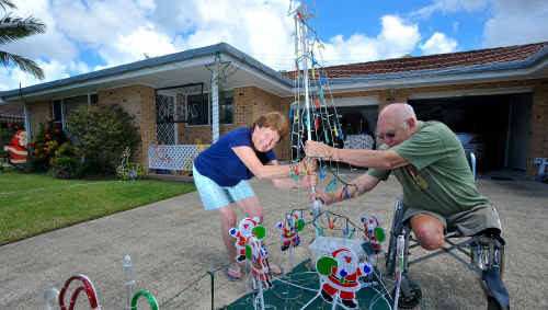 Light show: Lesley Close residents Ron Cowling and neighbour Bronwyn Humphreys won’t let rising power prices be The Grinch of Christmas. Light show: Lesley Close residents Ron Cowling and neighbour Bronwyn Humphreys won’t let rising power prices be The Grinch of Christmas.
